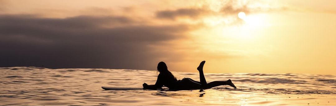 Butt Snorkeler brand origin - surfer at sunset